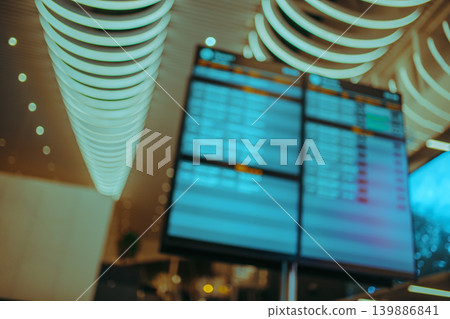 Departure board at airport, abstract out of focus background Departure board at airport, abstract out of focus background 139886841