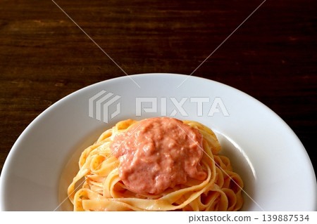 Tagliatelle with cod roe cream pasta (table background) Tagliatelle with cod roe cream pasta (table background) 139887534