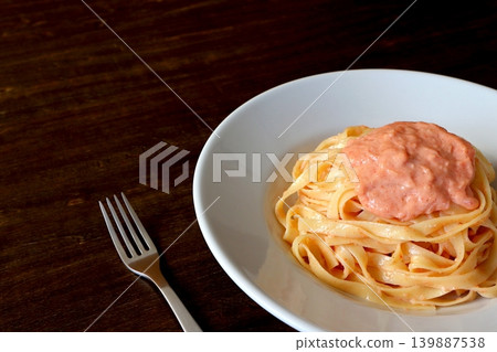 Tagliatelle with cod roe cream pasta (table background) Tagliatelle with cod roe cream pasta (table background) 139887538