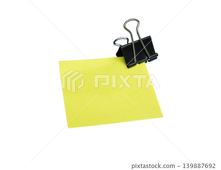 Close-up Yellow note and clip isolated on white background with copy space Close-up Yellow note and clip isolated on white background with copy space 139887692