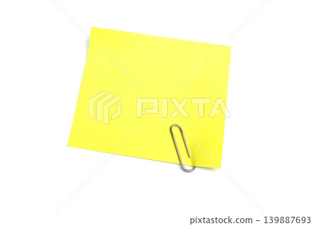 Close-up Yellow note and clip isolated on white background with copy space Close-up Yellow note and clip isolated on white background with copy space 139887693