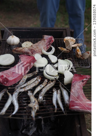 Grilling seafood over charcoal on a barbecue grill (3) Grilling seafood over charcoal on a barbecue grill (3) 139888074
