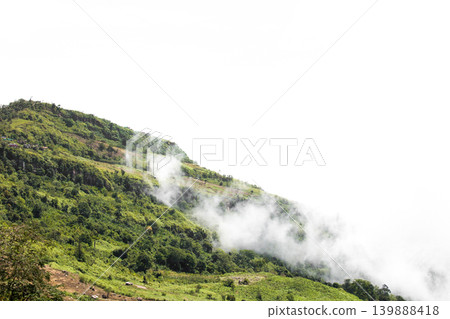 Close-up Fog and cloud mountain valley landscape In the Rainy season with white background Close-up Fog and cloud mountain valley landscape In the Rainy season with white background 139888418