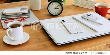 An office desk scene depicting a break time with colleagues. An office desk scene depicting a break time with colleagues. 139888615