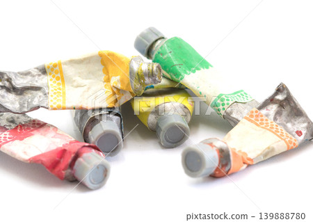 Close-up Old tube of artist oil paint with many colors on white background with copy space Close-up Old tube of artist oil paint with many colors on white background with copy space 139888780