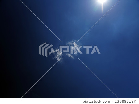 White clouds in a deep blue sky White clouds in a deep blue sky 139889187