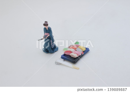 Miniature sushi platter with traditional cultural figure 139889887