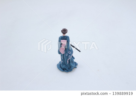 a Miniature traditional figure holding sword kneeling pose a Miniature traditional figure holding sword kneeling pose 139889919