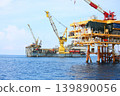 Rig along side the offshore platform for operation. Oil and gas industry in the gulf or the sea for operation. Maintenance and operation service with the construction platform by engineer. 139890056