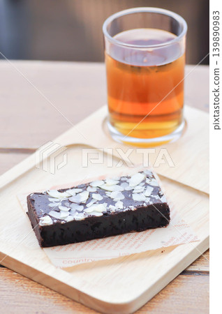 brownie , chocolate cake with almond topping and lemon tea brownie , chocolate cake with almond topping and lemon tea 139890983