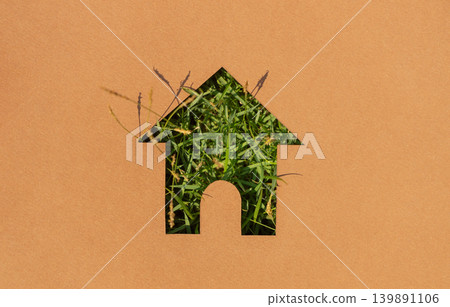 House symbol with grass texture cut on paper,sustainable housing, green living House symbol with grass texture cut on paper,sustainable housing, green living 139891106