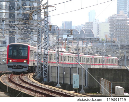 April 1, 2021: Tobu 70000 series train entering Kita-Senju Station on the Hibiya Line. April 1, 2021: Tobu 70000 series train entering Kita-Senju Station on the Hibiya Line. 139891739