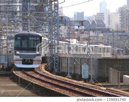 April 1, 2021: Tokyo Metro 13000 series train entering Kita-Senju Station on the Hibiya Line. 139891740