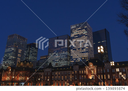 Tokyo Station at dusk, the path of light leading to the Imperial Palace, and the skyscrapers on Christmas Eve. 139893874