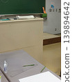 A quiet moment between classes. This image captures a scene of studying, depicted by the stationery lined up on the desk. 139894642