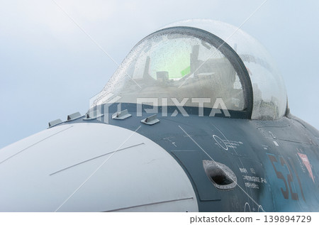 The cockpit of a Japan Air Self-Defense Force F-2A fighter jet in the rain. 139894729