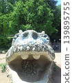 The park's symbol! Play on the dinosaur slide adorned with colorful mosaic tiles. 139895755