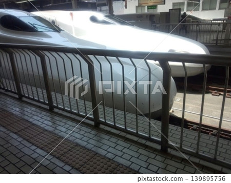 The sight of Shinkansen bullet trains lined up on the platform, a symbol of Japanese travel. The sight of Shinkansen bullet trains lined up on the platform, a symbol of Japanese travel. 139895756