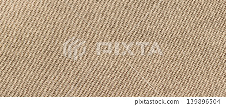 Beige knitted cotton fabric texture with fine diagonal weave pattern as a horizontal background Beige knitted cotton fabric texture with fine diagonal weave pattern as a horizontal background 139896504