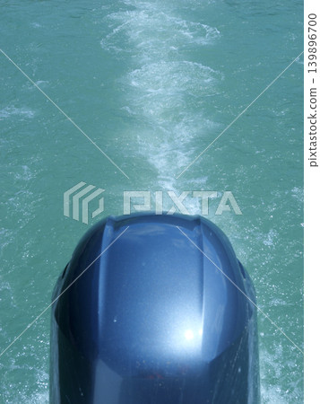 Outboard motor, waves, sunny day in April Outboard motor, waves, sunny day in April 139896700