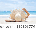 Woman lies on the white sand on the beach 139896776