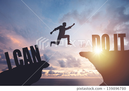 Silhouette of a man jumping from cliff to cliff, business and success concept Silhouette of a man jumping from cliff to cliff, business and success concept 139896780