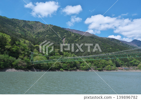 Igawa Dam, Igawa Lake, Oi River, sightseeing boat cruise, Igawa Bridge, sunny day in April Igawa Dam, Igawa Lake, Oi River, sightseeing boat cruise, Igawa Bridge, sunny day in April 139896782