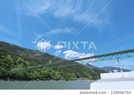 Igawa Dam, Igawa Lake, Oi River, sightseeing boat cruise, Igawa Bridge, sunny day in April Igawa Dam, Igawa Lake, Oi River, sightseeing boat cruise, Igawa Bridge, sunny day in April 139896784