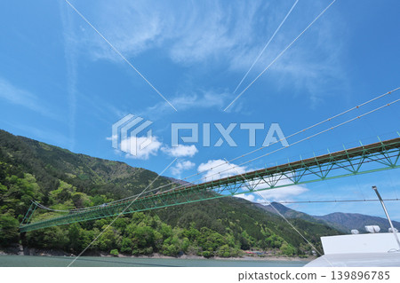 Igawa Dam, Igawa Lake, Oi River, sightseeing boat cruise, Igawa Bridge, sunny day in April Igawa Dam, Igawa Lake, Oi River, sightseeing boat cruise, Igawa Bridge, sunny day in April 139896785