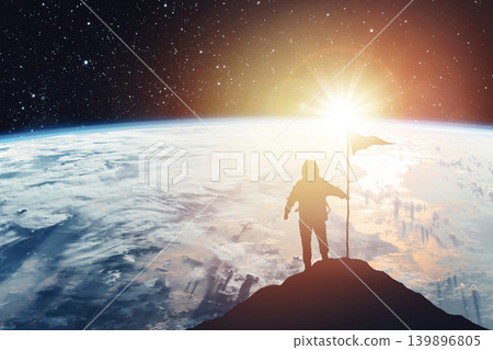 Silhouette of an astronaut with a flag against the backdrop of a planet and a shining star. Elements of this image furnished by NASA Silhouette of an astronaut with a flag against the backdrop of a planet and a shining star. Elements of this image furnished by NASA 139896805