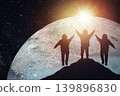 Silhouette of three astronauts against the background of the planet, space exploration. Elements of this image courtesy of NASA 139896830
