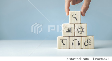 Hand putting and stacking blank wooden cubes on table Hand putting and stacking blank wooden cubes on table 139896872