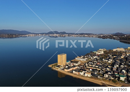 Aerial photograph capturing the townscape along the shores of Lake Shinji in Shimane Prefecture. 139897900