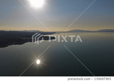 Aerial photograph showing the shoreline and mountain range of Lake Shinji in Shimane Prefecture. Aerial photograph showing the shoreline and mountain range of Lake Shinji in Shimane Prefecture. 139897905
