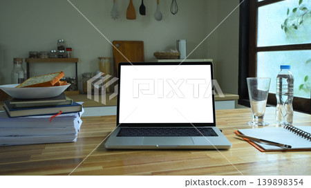 Laptop mockup on wooden desk with breakfast and window light Laptop mockup on wooden desk with breakfast and window light 139898354