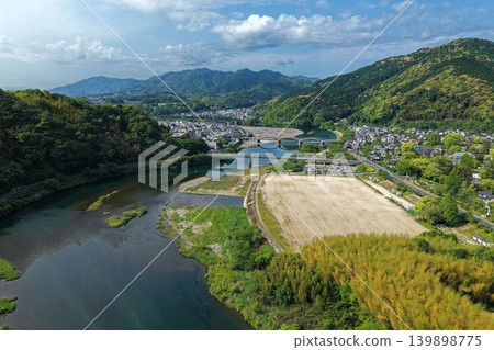 An aerial photograph overlooking Kintaikyo Bridge and Nishiki River in Iwakuni City, Yamaguchi Prefecture. 139898775