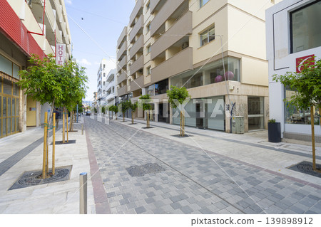 A pedestrianized street lined with trees and buildings in Larnaka, Cyprus A pedestrianized street lined with trees and buildings in Larnaka, Cyprus 139898912