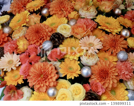 Autumn-colored floral background featuring orange dahlias and yellow gerberas. Japanese texture background | Advertising, beauty, bridal, shops Autumn-colored floral background featuring orange dahlias and yellow gerberas. Japanese texture background | Advertising, beauty, bridal, shops 139899311