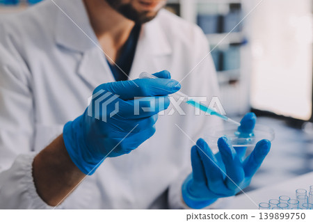 Lab technician experimenting in lab Lab technician experimenting in lab 139899750