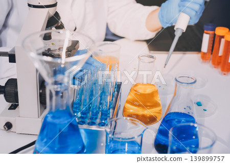 Lab technician experimenting in lab Lab technician experimenting in lab 139899757