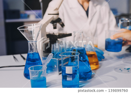 Lab technician experimenting in lab Lab technician experimenting in lab 139899760