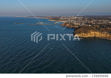 Aerial photograph taken in the spring evening overlooking Cape Kasa and the fishing port in Kaga City, Ishikawa Prefecture. Aerial photograph taken in the spring evening overlooking Cape Kasa and the fishing port in Kaga City, Ishikawa Prefecture. 139899886