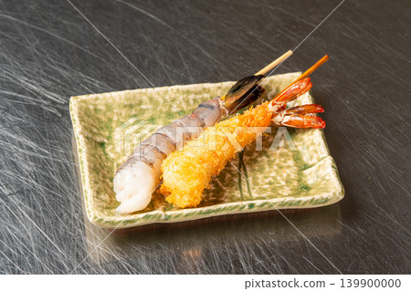 Delicious deep-fried shrimp skewers with a crispy coating. Delicious deep-fried shrimp skewers with a crispy coating. 139900000