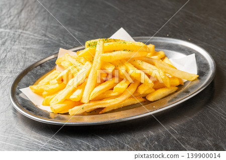 French fries: A classic potato dish with a popular crispy texture. French fries: A classic potato dish with a popular crispy texture. 139900014