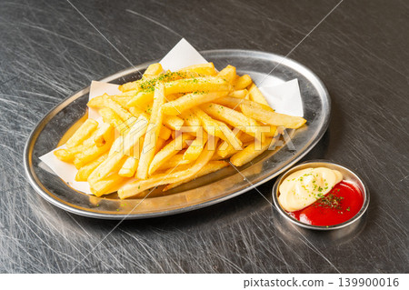 French fries: A classic potato dish with a popular crispy texture. French fries: A classic potato dish with a popular crispy texture. 139900016