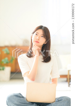 Japanese woman troubled with her laptop Japanese woman troubled with her laptop 139900172