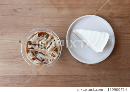 iced coffee , iced latte coffee or iced cappuccino coffee and coconut cake iced coffee , iced latte coffee or iced cappuccino coffee and coconut cake 139900714