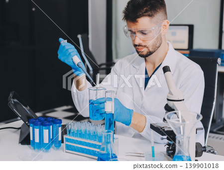 Lab technician experimenting in lab Lab technician experimenting in lab 139901018