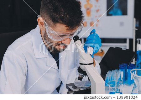 Lab technician experimenting in lab Lab technician experimenting in lab 139901024