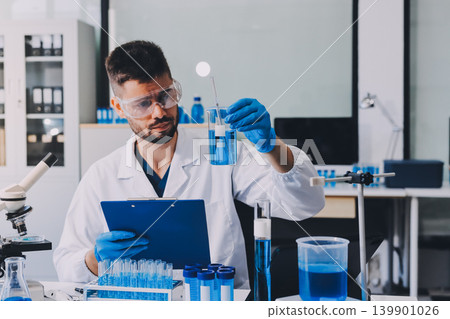 Lab technician experimenting in lab Lab technician experimenting in lab 139901026